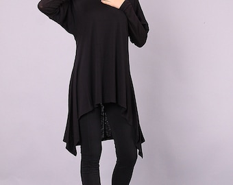 May include: Black long-sleeved tunic top with a high-low hemline. The top is made of a soft, stretchy fabric and has a relaxed fit.