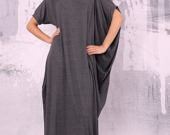 May include: A long, grey, loose-fitting dress with short sleeves. The dress has a relaxed, casual fit and a flowing silhouette.