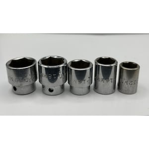 May include: A set of five silver-colored metal socket wrench attachments arranged in a row. Each cylindrical socket features a hexagonal opening and is clearly stamped with its specific metric size, including 19mm, 18mm, 16mm, 14mm, and 12mm.