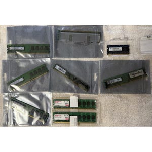 May include: A collection of computer RAM memory modules in various formats, including long DIMM sticks and shorter SO-DIMM sticks. Several modules are enclosed in individual clear plastic anti-static bags, while two are in a clear plastic tray.