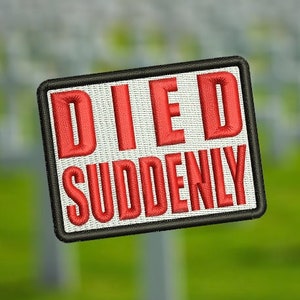 May include: A white patch with black trim and red embroidered text that reads "DIED SUDDENLY" against a blurred background of white crosses.