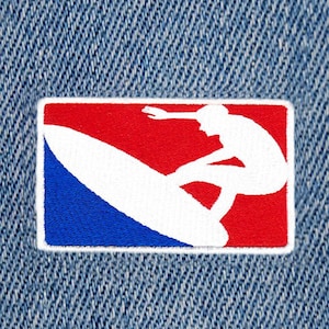 May include: An embroidered patch in red, white and blue featuring a silhouette of a surfer riding a wave.
