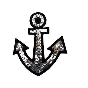 May include: A black and silver anchor-shaped patch with sequins. The anchor is outlined in black and has a silver sequin design.