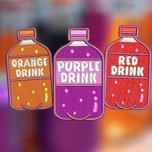 May include: Three embroidered iron-on patches shaped like soda bottles. The bottles are labeled "Orange Drink", "Purple Drink", and "Red Drink".
