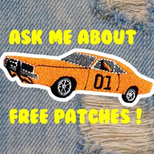 Puede incluir: Parche bordado naranja de un coche con el número "01" en el lateral. El parche está sobre un fondo de mezclilla azul con el texto "Ask me about free patches!" en amarillo.