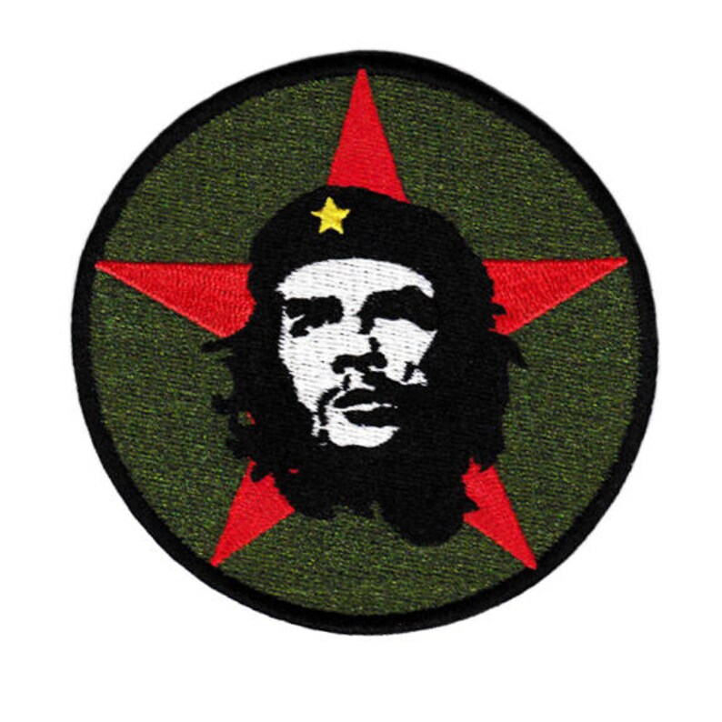 May include: Embroidered patch featuring a red star with a black and white image of Che Guevara inside. The star is on a green background.