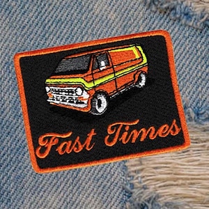 May include: An orange and yellow van with the text "Fast Times" on a black background. The patch is surrounded by an orange border.