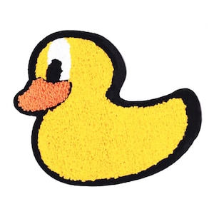 May include: A yellow rubber duck with a black outline and an orange beak. The duck is a cartoon-style illustration.