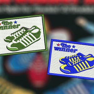 May include: Embroidered patches featuring sneakers with the text "The Winner." One patch has green and white sneakers, the other has blue and yellow sneakers. Both patches have a star above the word "winner."