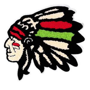 May include: A black and white embroidered patch of an Native American chief wearing a headdress with red and green accents.