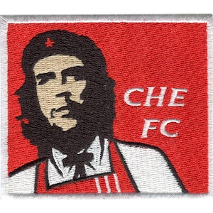 May include: A red and white embroidered patch featuring a cartoon image of Che Guevara wearing a red beret with a star and a white shirt with red stripes. The text "CHE FC" is embroidered in white on the patch.