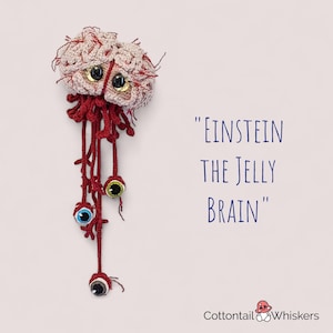 May include: Crocheted brain with googly eyes and red tentacles, titled "Einstein the Jelly Brain" by Cottontail & Whiskers.