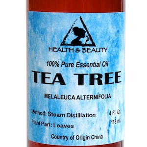 May include: A brown glass bottle with a white label that reads "HEALTH & BEAUTY 100% Pure Essential Oil TEA TREE MELALEUCA ALTERNIFOLIA Method: Steam Distillation Plant Part: Leaves Country of Origin China 4 Fl. Oz. 118 ml."