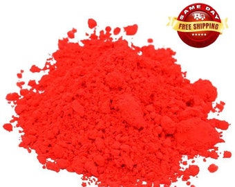 May include: A pile of bright red powder, likely used for coloring or crafts.