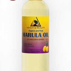 May include: A clear glass bottle with a white cap filled with yellow marula oil. The label is yellow with a purple triangle and text that reads "HEALTH & BEAUTY Organic and Pure MARULA OIL SCLEROCARYA BIRREA 4 FL. OZ. 118 ml Extraction Method: Cold Pressed Refined Country Of Origin Namibia Exp. date"