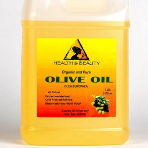 May include: A yellow plastic jug of organic and pure olive oil, labeled "Health & Beauty Olive Oil Olea Europaea", with a green olive branch illustration. The jug contains 7 pounds (3178 ml) of oil and is labeled "All Natural, Cold Pressed Refined, Obtained from Fruit Pulp, Country of Origin Italy".