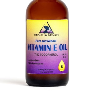 May include: A brown glass bottle with a black cap, labeled "Health & Beauty Pure and Natural Vitamin E Oil T-50 Tocopherol 1 Fl. Oz 30 ml Antioxidant Skin Protection E Country Of Origin USA Exp. date"
