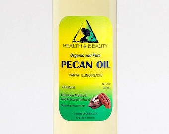 May include: A clear glass bottle with a yellow label that reads "HEALTH & BEAUTY Organic and Pure PECAN OIL CARYA ILLINOINENSIS All Natural Extraction Method: Cold Pressed Refined Obtained from NUTS Country Of Origin USA Exp. date 12 Fl. Oz. 355 ml."