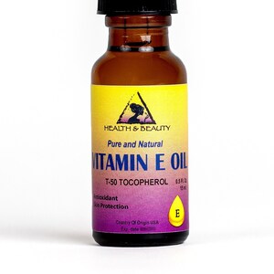 May include: A brown glass bottle of Vitamin E Oil with a black dropper. The label reads "Health & Beauty, Pure and Natural Vitamin E Oil, T-50 Tocopherol, Antioxidant Skin Protection". The bottle contains 0.5 fl oz (15 ml).