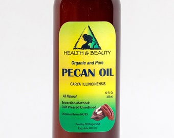 May include: A brown glass bottle with a green and yellow label that reads "HEALTH & BEAUTY Organic and Pure PECAN OIL CARYA ILLINOINENSIS All Natural 12 Fl. Oz. 355 ml. Extraction Method: Cold Pressed Unrefined Obtained from NUTS Country Of Origin USA Exp. date"