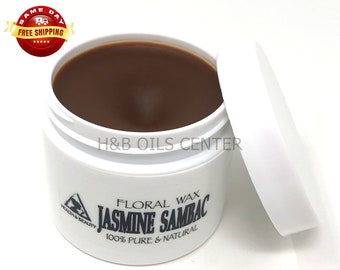 May include: A white jar with a brown lid containing a brown floral wax. The label reads "Floral Wax Jasmine Sambac 100% Pure & Natural".