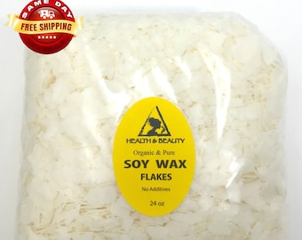 May include: A clear plastic bag filled with white soy wax flakes. The bag has a yellow label that reads "Health & Beauty", "Organic & Pure", "Soy Wax Flakes", "No Additives", and "24 oz".
