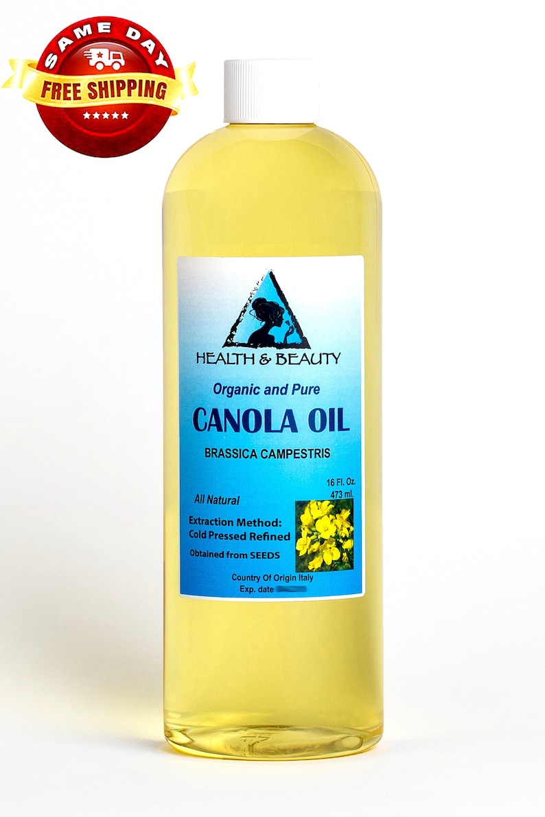 May include: A clear glass bottle of organic and pure canola oil, labeled "Health & Beauty" with a blue triangle logo. The bottle contains 16 fluid ounces (473 ml) and is labeled "All Natural" with the extraction method, "Cold Pressed Refined", and the origin of the oil, "Country of Origin Italy".