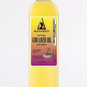 May include: A clear glass bottle of pure virgin cod liver oil with a yellow label. The label features a triangle with a woman's silhouette inside, the words "Health & Beauty", and the text "Pure Virgin Cod Liver Oil". The label also includes the scientific name for cod, "Gadus Morrhua", and information about the oil's omega-3 fatty acids, vitamins A and D, extraction method, and country of origin.