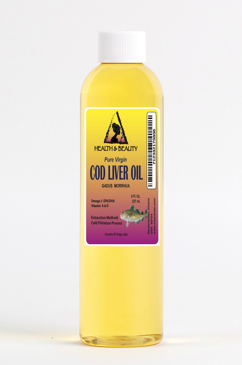 May include: A clear glass bottle of pure virgin cod liver oil with a yellow label. The label features a triangle with a woman's silhouette inside, the words "Health & Beauty", and the text "Pure Virgin Cod Liver Oil". The label also includes the scientific name for cod, "Gadus Morrhua", and information about the oil's omega-3 fatty acids, vitamins A and D, extraction method, and country of origin.