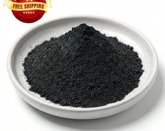 May include: A white ceramic bowl filled with a mound of fine, black powder. The powder has a granular texture and is piled high in the center of the bowl. A red and yellow banner with the words "SAME DAY FREE SHIPPING" is in the upper left corner.