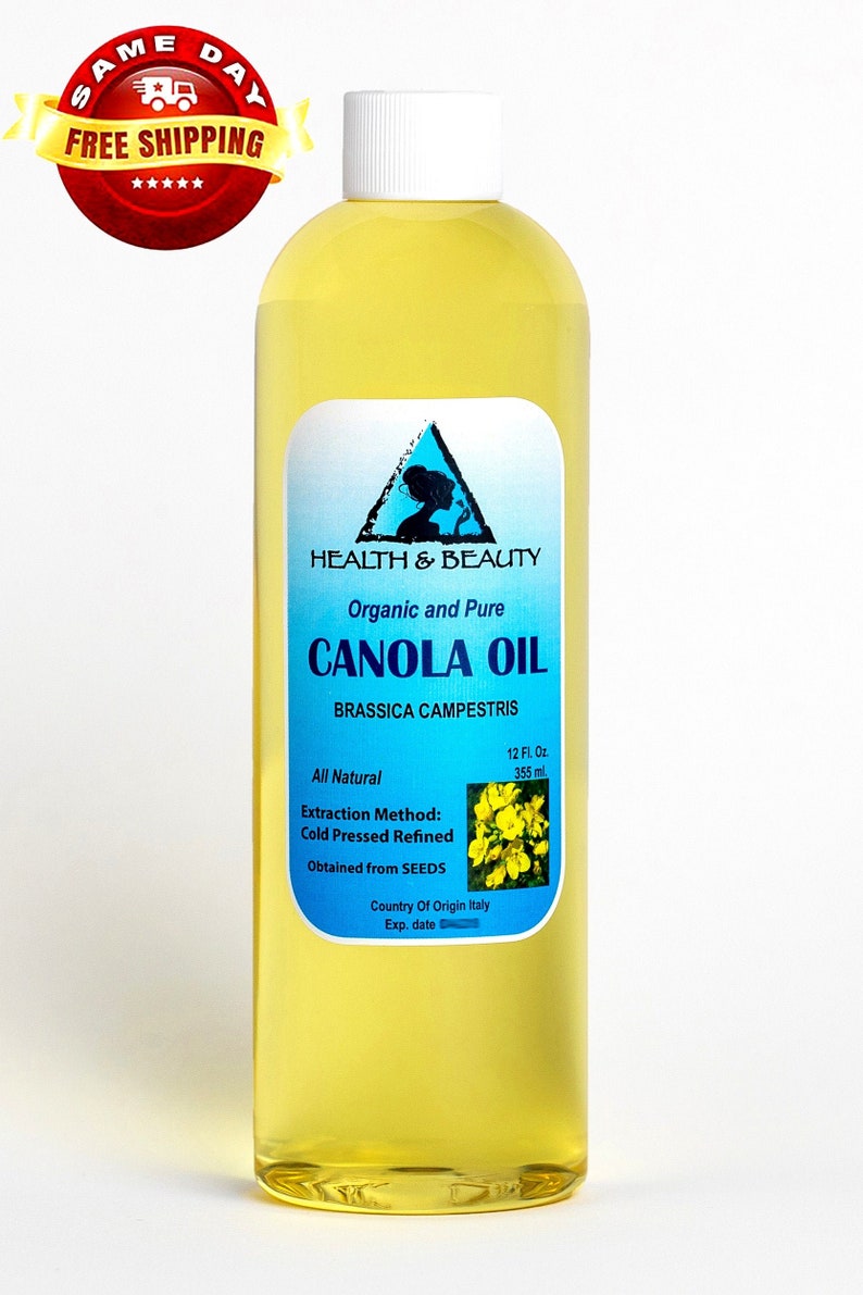 May include: A clear glass bottle of organic and pure canola oil, labeled "Health & Beauty" with a blue triangle logo. The bottle contains 12 fluid ounces (355 ml) and is labeled "Cold Pressed Refined" and "Obtained from SEEDS". The label also states "Country of Origin Italy".