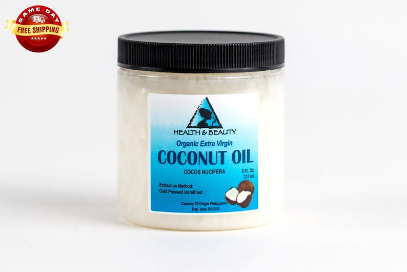 May include: A clear glass jar with a black lid filled with white coconut oil. The label reads "Health & Beauty Organic Extra Virgin Coconut Oil Cocos Nucifera 8 Fl. Oz. 237 ml. Extraction Method: Cold Pressed Unrefined Country of Origin: Philippines"