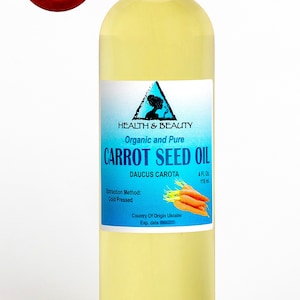 May include: A clear glass bottle with a white cap filled with yellow carrot seed oil. The label is blue and white with the text "HEALTH & BEAUTY", "Organic and Pure", "CARROT SEED OIL", "DAUCUS CAROTA", "4 Fl. Oz. 118ml", "Extraction Method: Cold Pressed", "Country Of Origin Ukraine", and "Exp. date".