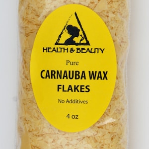 May include: A clear plastic bag filled with yellow carnauba wax flakes. The bag has a yellow label with the text "HEALTH & BEAUTY", "Pure", "CARNAUBA WAX FLAKES", "No Additives", and "4 oz".
