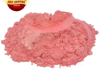 May include: A close-up of a pile of pink mica powder with a shimmery finish. The powder is fine and loose, and it has a light, airy texture.