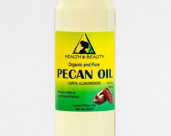 May include: A clear glass bottle with a white cap filled with pecan oil. The label is yellow with green text and a green triangle. The label reads "Health & Beauty Organic and Pure Pecan Oil Carya Illinoinensis 4 Fl. Oz 115 ml Extraction Method: Cold Pressed Refined Country of Origin USA Exp. date"