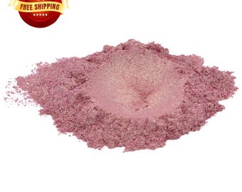 May include: A pile of pink mica powder with a shimmery finish. The powder is a fine, loose texture and is perfect for adding a touch of sparkle to crafts and projects.