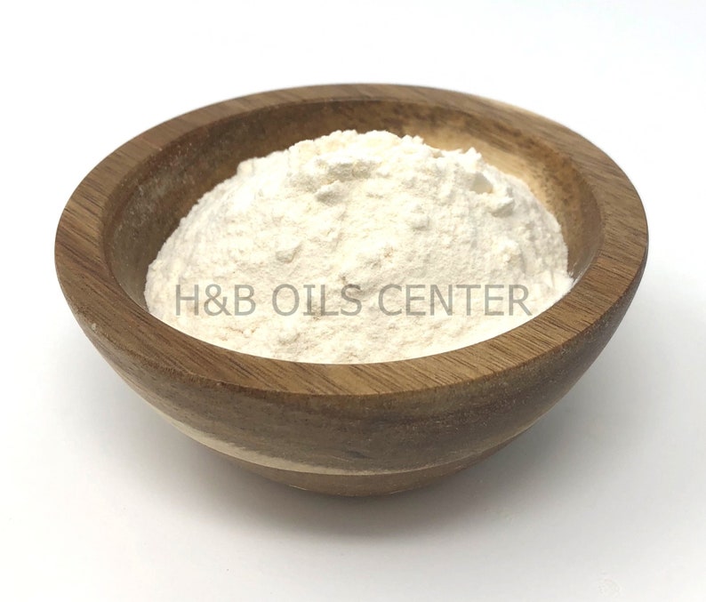 May include: A white powder in a wooden bowl. The bowl is labeled "H&B Oils Center".