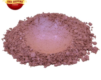 May include: A small pile of loose, shimmery, iridescent pink cosmetic pigment powder.