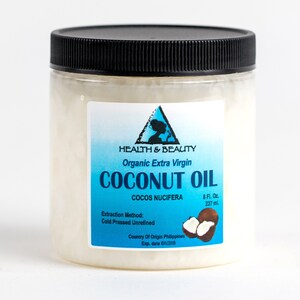 May include: A clear plastic jar with a black lid filled with white coconut oil. The label is blue and white and reads "HEALTH & BEAUTY Organic Extra Virgin COCONUT OIL COCOS NUCIFERA 8 Fl. Oz. 237 ml. Extraction Method: Cold Pressed Unrefined Country Of Origin Philippines Exp. date"