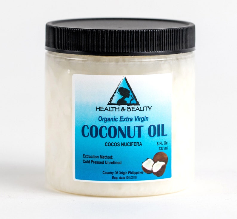 May include: A clear plastic jar with a black lid filled with white coconut oil. The label is blue and white and reads "HEALTH & BEAUTY Organic Extra Virgin COCONUT OIL COCOS NUCIFERA 8 Fl. Oz. 237 ml. Extraction Method: Cold Pressed Unrefined Country Of Origin Philippines Exp. date"