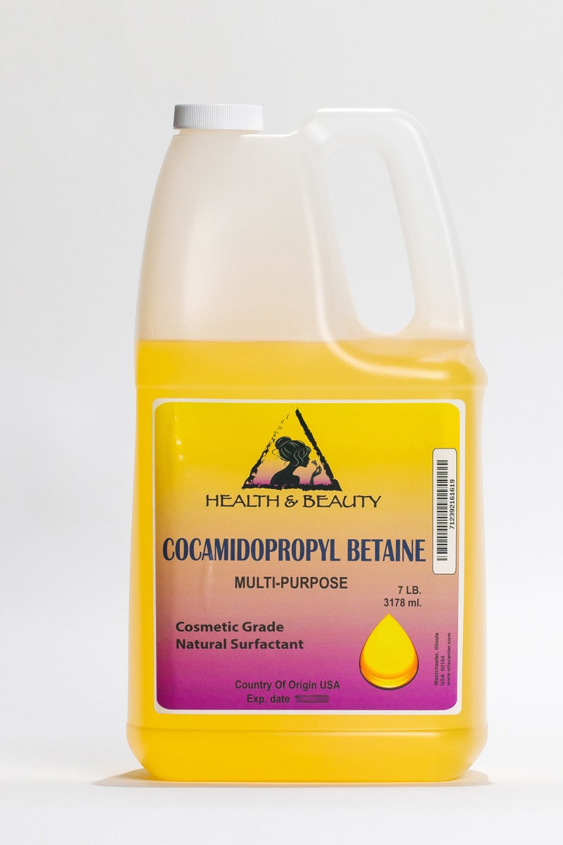 May include: A yellow plastic jug with a white cap and a label that reads "HEALTH & BEAUTY COCAMIDOPROPYL BETAINE MULTI-PURPOSE Cosmetic Grade Natural Surfactant Country Of Origin USA Exp. date 7 LB. 3178 ml."