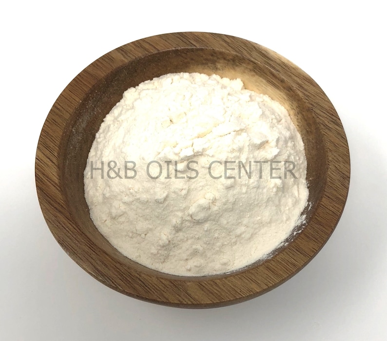 May include: A white powder in a wooden bowl. The powder is labeled "H&B Oils Center".