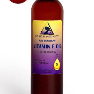 May include: A brown glass bottle of Vitamin E oil with a purple and yellow label. The label reads "Health & Beauty, Pure and Natural, Vitamin E Oil, T-50 Tocopherol, Antioxidant Skin Protection, 8 Fl. Oz, 237 ml, Country of Origin USA, Exp. date".