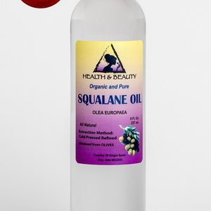 May include: A clear glass bottle with a white cap containing 8 fluid ounces of organic and pure squalane oil. The label is yellow with a purple triangle and text that reads "Health & Beauty", "Organic and Pure", "Squalane Oil", "Olea Europaea", "All Natural", "Extraction Method: Cold Pressed Refined", "Obtained from Olives", "Country of Origin Spain", and "Exp. date".