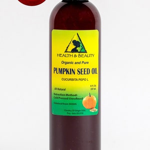 May include: A brown glass bottle with a yellow label that reads "HEALTH & BEAUTY Organic and Pure PUMPKIN SEED OIL CUCURBITA PEPO L All Natural 8 Fl. Oz. 237 ml. Extraction Method: Cold Pressed Unrefined Obtained from SEEDS Country Of Origin USA Exp. date" and a small image of a pumpkin.