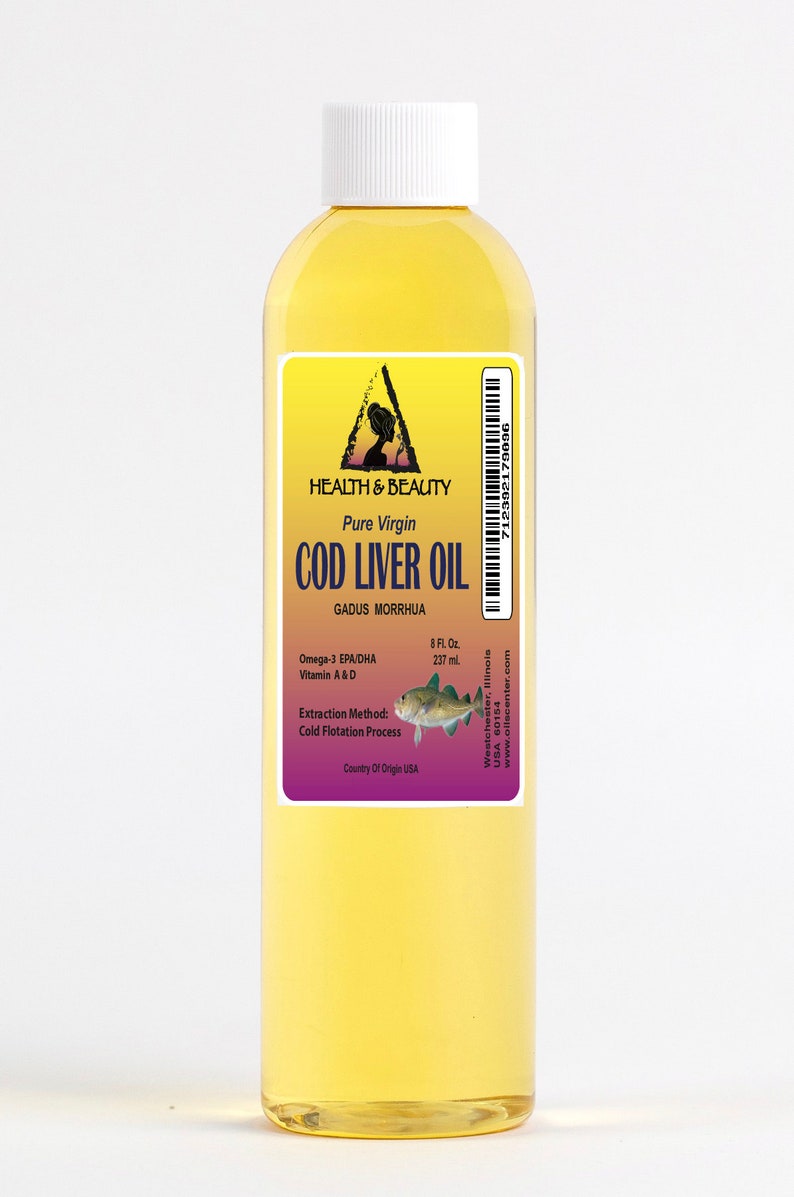 May include: A clear glass bottle of pure virgin cod liver oil with a yellow label. The label features a triangle with a woman's silhouette inside, the words "Health & Beauty", and the text "Pure Virgin Cod Liver Oil". The label also includes the scientific name for cod, "Gadus Morrhua", and information about the oil's omega-3 fatty acids, vitamins A and D, extraction method, and country of origin.