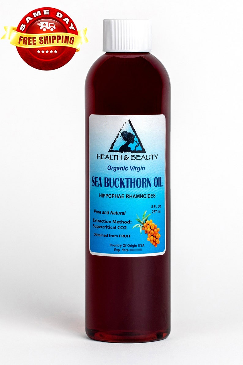 May include: A clear glass bottle with a white cap filled with a dark red liquid. The label reads "HEALTH & BEAUTY Organic Virgin SEA BUCKTHORN OIL HIPPOPHAE RHAMNOIDES 8 Fl. Oz. 237 ml. Pure and Natural Extraction Method: Supercritical CO2 Obtained from FRUIT Country Of Origin USA Exp. date"