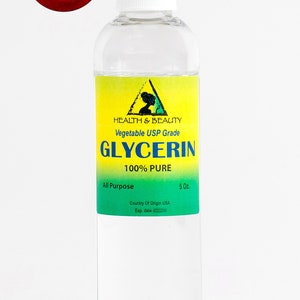 May include: A clear glass bottle with a white cap containing 5 ounces of 100% pure vegetable glycerin. The label is green and yellow with the text "HEALTH & BEAUTY Vegetable USP Grade GLYCERIN 100% PURE All Purpose 5 Oz. Country Of Origin USA Exp. date"
