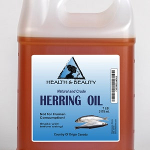 May include: A gallon jug of amber-colored herring oil with a white label. The label reads "Health & Beauty Natural and Crude Herring Oil 7 LB. 3178 ml. Not for Human Consumption! Shake well before using! Country of Origin Canada".